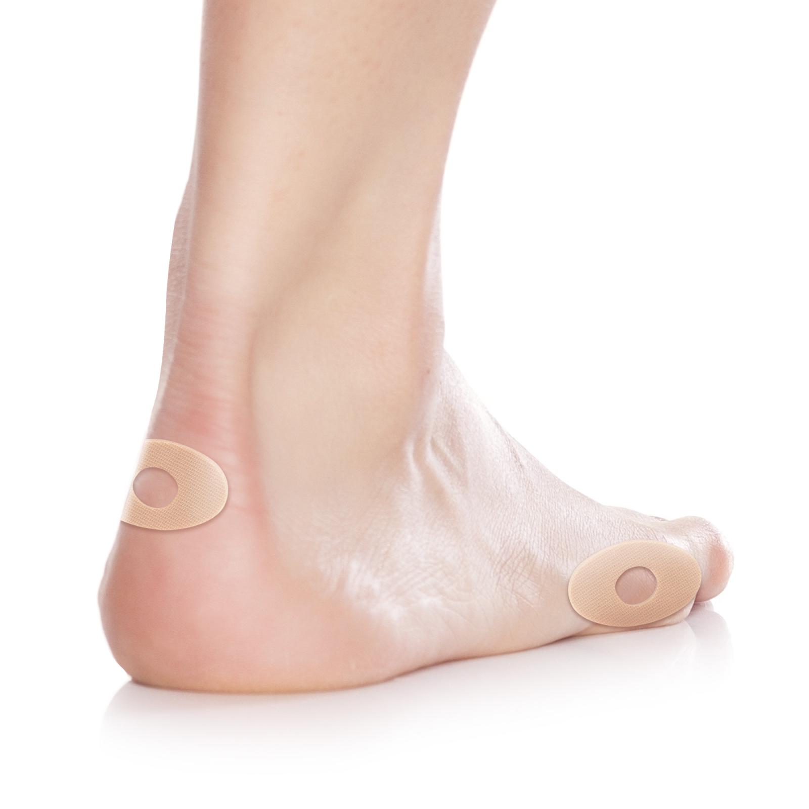 Protectores ovales grandes para los pies con orificio central, fabricados en látex.