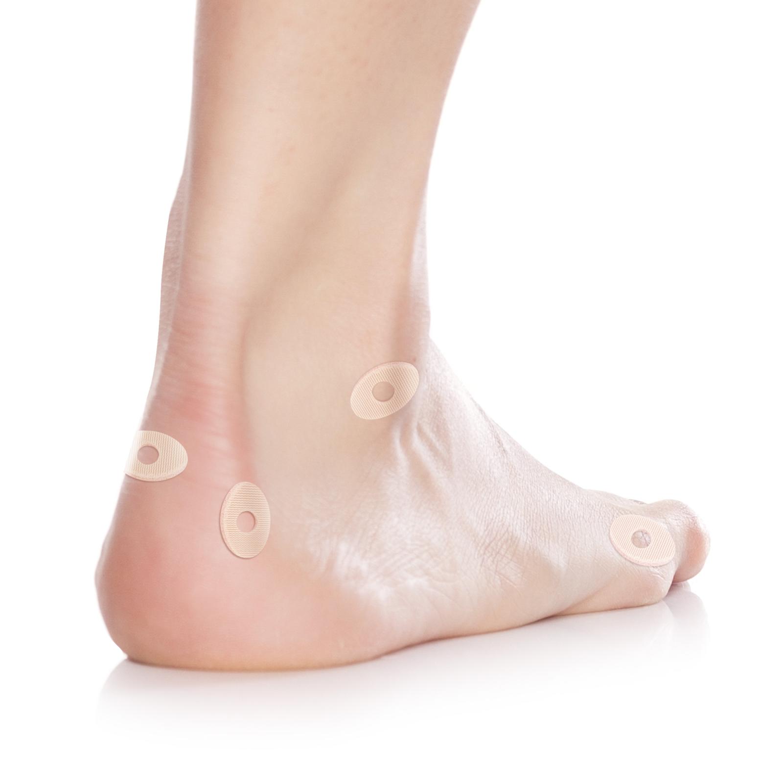 Protectores ovales pequeños para los pies con orificio central, fabricados en látex.